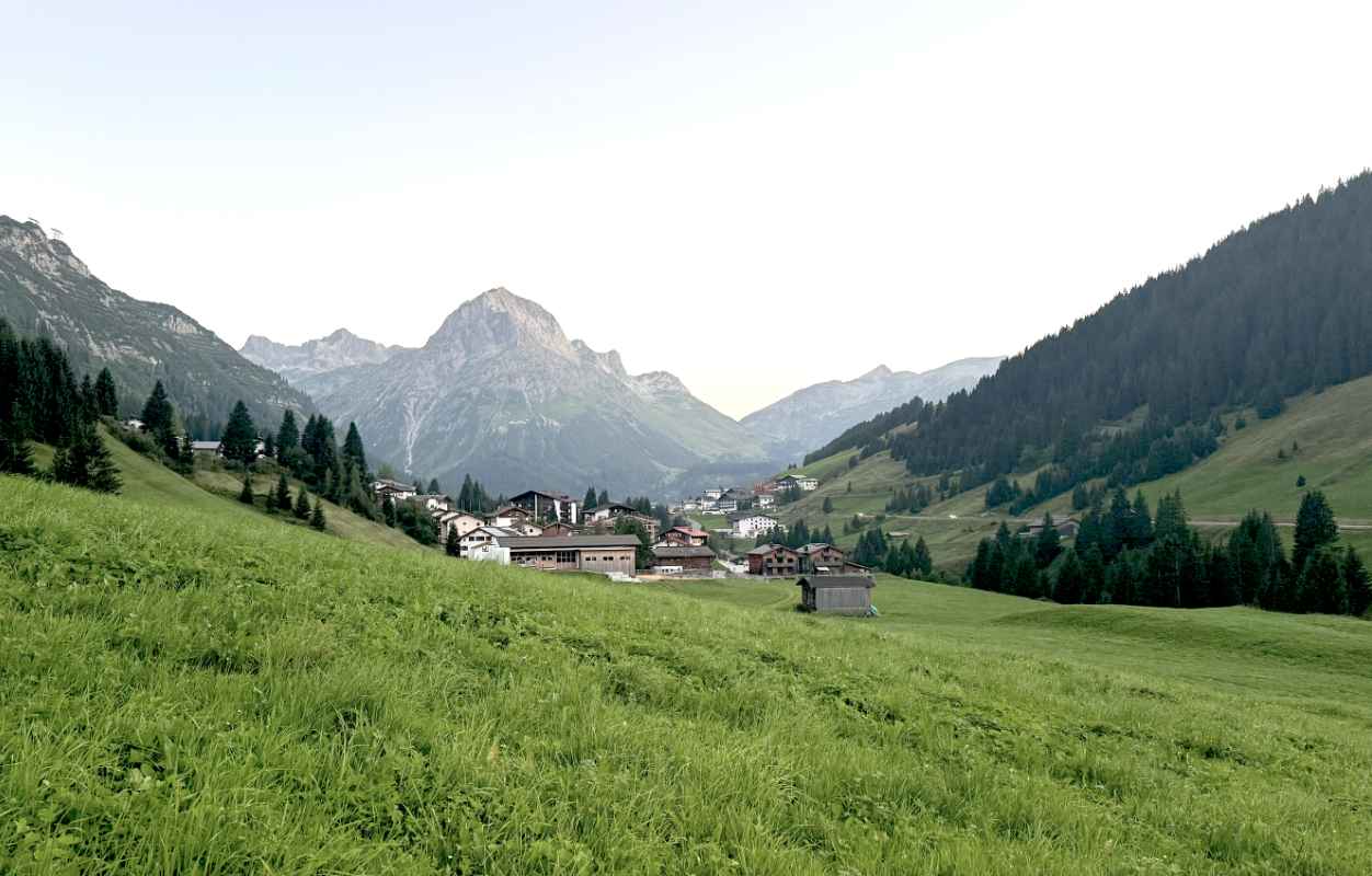 Panoramic shot of the mountain landscape with the village in the valley