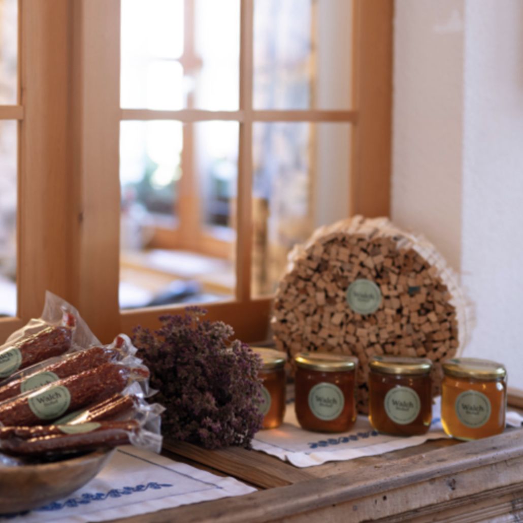 small selection of fresh organic products such as sausages and honey